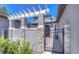 Charming gated front entrance with stone accents and lush greenery, offering privacy and curb appeal at 288 Villa Corte Dr, Lutz, FL 33549
