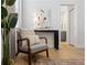 Cozy seating area in the main bedroom with natural light and calming gray walls at 288 Villa Corte Dr, Lutz, FL 33549
