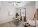 Bright office space with a ceiling fan, a gray desk, decor, seating, and a window to provide natural light at 288 Villa Corte Dr, Lutz, FL 33549