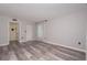Spacious bedroom with laminate flooring and a bathroom entrance at 3114 Lake Pine Way # H2, Tarpon Springs, FL 34688