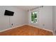 Bedroom features a window providing natural light and laminate wood flooring at 3114 Lake Pine Way # H2, Tarpon Springs, FL 34688