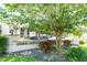 Community sign surrounded by mature trees and landscaping at 3114 Lake Pine Way # H2, Tarpon Springs, FL 34688