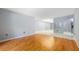 Bright, open-concept living space featuring tile and wood flooring at 3114 Lake Pine Way # H2, Tarpon Springs, FL 34688