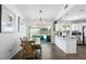 Open-concept dining and kitchen area with sliding doors to the pool and stainless appliances at 3133 Payne St, New Port Richey, FL 34655
