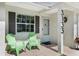 Inviting porch area with chairs and a view of the front of the home at 3133 Payne St, New Port Richey, FL 34655