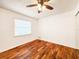Bedroom with wood-look flooring and a ceiling fan at 3304 Alamar St, Lutz, FL 33558