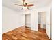 Bedroom featuring hard surface flooring and a sliding-door closet at 3304 Alamar St, Lutz, FL 33558