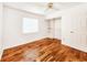 Bright bedroom featuring hard surface flooring and a ceiling fan at 3304 Alamar St, Lutz, FL 33558