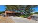 Charming single-story home with a well-maintained front yard, mature shade tree, and a long driveway at 3304 Alamar St, Lutz, FL 33558