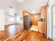 Open concept kitchen showcases hardwood floors, stainless steel appliances, and convenient access to the living areas at 3304 Alamar St, Lutz, FL 33558