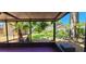 Enjoy outdoor living on the covered patio, overlooking the lush landscaped backyard at 3304 Alamar St, Lutz, FL 33558
