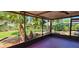 A spacious covered patio offers an awesome view of the gorgeous backyard landscaping at 3304 Alamar St, Lutz, FL 33558