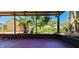 Enjoy outdoor living from this peaceful covered patio with a manicured lawn at 3304 Alamar St, Lutz, FL 33558