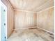 Interior view of an empty shed featuring plywood walls and floors, ready for storage at 3304 Alamar St, Lutz, FL 33558