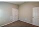 Comfortable bedroom with plush carpeting, and a spacious double door closet, perfect for storage at 36958 Sagemoor Dr, Zephyrhills, FL 33541