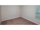 Inviting bedroom featuring carpet, a window for natural light, and is ideal for relaxation at 36958 Sagemoor Dr, Zephyrhills, FL 33541