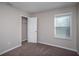 Bedroom featuring a window, carpeted floor, closet, and neutral paint at 36964 Sagemoor Dr, Zephyrhills, FL 33541