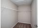 Walk-in closet with a single wire shelf and carpeted flooring at 36964 Sagemoor Dr, Zephyrhills, FL 33541