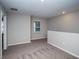 Carpeted upstairs hallway featuring natural light from a window at 36964 Sagemoor Dr, Zephyrhills, FL 33541