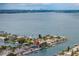Gorgeous aerial view of waterfront neighborhood with city skyline in the distance at 417 41St Ave, St Pete Beach, FL 33706