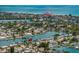 Gorgeous aerial view of neighborhood canals with turquoise ocean and pink hotel in the background at 417 41St Ave, St Pete Beach, FL 33706