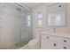 Modern bathroom featuring a glass shower, toilet and vanity with stylish stone accents at 417 41St Ave, St Pete Beach, FL 33706
