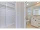 Bright bathroom featuring a toilet and vanity with stylish mirror and neutral color palette at 417 41St Ave, St Pete Beach, FL 33706