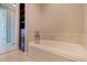 Elegant bathtub featuring built-in storage and views of the ensuite bathroom at 417 41St Ave, St Pete Beach, FL 33706