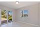 Light-filled bedroom with sliding glass doors leading to a patio and water views at 417 41St Ave, St Pete Beach, FL 33706