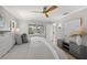 Serene bedroom featuring a ceiling fan, a contemporary dresser, and scenic waterfront views at 417 41St Ave, St Pete Beach, FL 33706