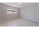 This bedroom includes a window for natural light and a closet with white shuttered doors at 417 41St Ave, St Pete Beach, FL 33706
