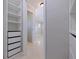 View of a bedroom showcasing a wardrobe and doorway leading to an ensuite bathroom at 417 41St Ave, St Pete Beach, FL 33706