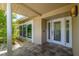 Inviting front entrance with a glass door, complemented by stone accents and tropical landscaping at 417 41St Ave, St Pete Beach, FL 33706