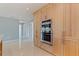 Modern kitchen features wooden cabinets, stainless steel appliances, and granite countertops at 417 41St Ave, St Pete Beach, FL 33706