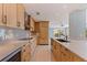 Modern kitchen features wooden cabinets, granite countertops, stainless steel appliances, and tiled backsplash at 417 41St Ave, St Pete Beach, FL 33706