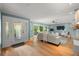 Comfortable living room with wood floors, ceiling fan and serene decor perfect for relaxing and entertaining at 417 41St Ave, St Pete Beach, FL 33706