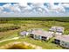 A scenic aerial shot of homes, a pond, and beautiful landscaping at 43250 Water Bird Way # 5921, Punta Gorda, FL 33982