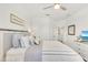 Bedroom with a ceiling fan, neutral-colored walls and carpet with lots of natural light at 43250 Water Bird Way # 5921, Punta Gorda, FL 33982