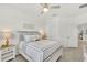 Neutral bedroom with a ceiling fan, neutral-colored walls, and carpet with lots of natural light at 43250 Water Bird Way # 5921, Punta Gorda, FL 33982