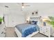 Bedroom featuring neutral-colored walls and carpet with a ceiling fan, and ample natural light at 43250 Water Bird Way # 5921, Punta Gorda, FL 33982
