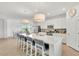 Kitchen with large island, stainless steel appliances and bar stool seating at 43250 Water Bird Way # 5921, Punta Gorda, FL 33982