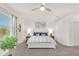 Bright main bedroom with a ceiling fan, neutral walls, and an abundance of natural light at 43250 Water Bird Way # 5921, Punta Gorda, FL 33982