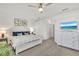 Inviting main bedroom features a ceiling fan, neutral carpet, and a large closet at 43250 Water Bird Way # 5921, Punta Gorda, FL 33982