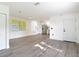 Spacious living room with new wood-look flooring and lots of natural light at 485 Stillwater Ave, Spring Hill, FL 34606