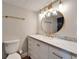 A bathroom with a well-lit vanity area and a toilet at 4895 Bay Ne St # 207, St Petersburg, FL 33703