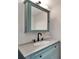 Updated bathroom vanity with a sink, medicine cabinet, and modern black fixtures at 4895 Bay Ne St # 207, St Petersburg, FL 33703