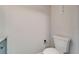 White toilet in a bathroom with a neutral paint scheme; vanity and fixtures are partially visible at 4895 Bay Ne St # 207, St Petersburg, FL 33703
