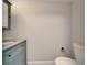 Bathroom with a vanity sink, a toilet, and neutral paint, creating a clean look at 4895 Bay Ne St # 207, St Petersburg, FL 33703