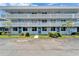 Inviting building with well-maintained lawn and blue doors, offering a welcoming curb appeal at 4895 Bay Ne St # 207, St Petersburg, FL 33703