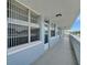 The building's hallway showcases a light blue exterior with railings and windows, offering a bright walkway at 4895 Bay Ne St # 207, St Petersburg, FL 33703